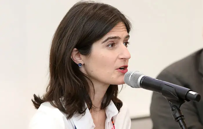 Juliet Sorenson speaking into a microphone