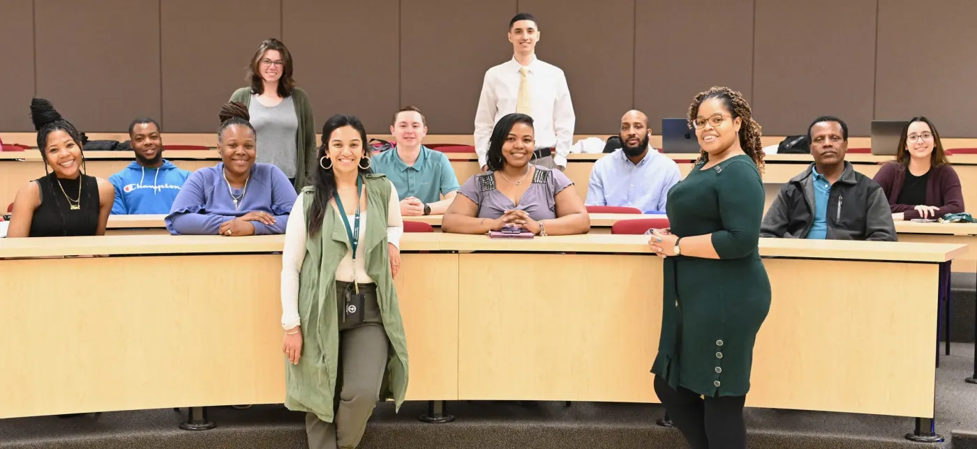 Students and faculty in a classroom.